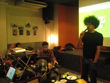 Presenting Dorkbot Madrid #9 at La Dinamo in Lavapiés in December 2005. Photo Credit: Murphy Karamaku